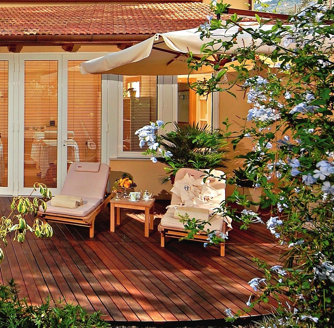 Plank flooring is just one option for flooring the patio adjacent to the house.